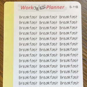 May include: A sheet of white stickers with the word "Breakfast" repeated 24 times in black cursive writing. The stickers are arranged in three columns of eight stickers each. The stickers are on a yellow background with the text "Workwrite Planner" and "S-11B" in black at the top of the sheet. The text "www.workwriteplanner.com" is at the bottom of the sheet.