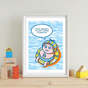 May include: A framed print featuring a cartoon baby floating in a yellow inner tube on a blue water background. The baby wears a striped hat and has a speech bubble that reads, "I hate the heat. I'm just trying to survive."