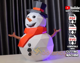 May include: A white papercraft snowman with a red scarf and black top hat. The snowman is standing on a white surface with a purple light shining on it. The image also includes text that says "YouTube Video Tutorial", "PDF", "STUDIO3", "SVG", "Compatible with Cutting Machine".