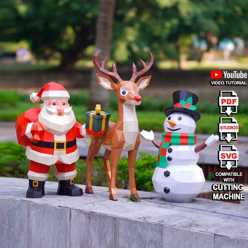 May include: Papercraft Christmas decorations featuring Santa Claus, a reindeer, and a snowman. Santa wears a red suit with a black belt and boots. The reindeer holds a gift box. The snowman has a top hat and a scarf. The image includes text for a YouTube video tutorial.