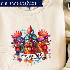 Colorful graphic of three wacky hens, wearing glasses and bandanas, with a crazed look in their eyes. The banner at the bottom reads We're all crazy, it's not a competition