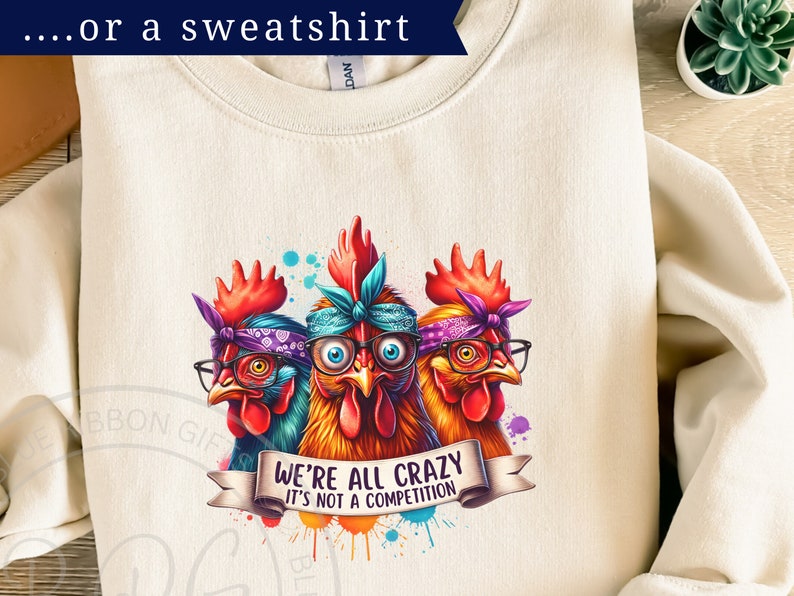 Colorful graphic of three wacky hens, wearing glasses and bandanas, with a crazed look in their eyes. The banner at the bottom reads We're all crazy, it's not a competition
