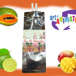 May include: A silver pouch with a colorful "Art of Animation" logo and a picture of a Disney castle. The pouch is next to a papaya, a lime, and a mango.