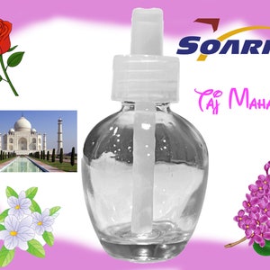 May include: A clear glass bottle with a white cap and a long white dropper. The bottle is labelled "Soarin' Taj Mahal".