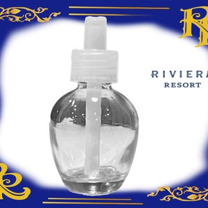 May include: A clear glass bottle with a white dropper top. The bottle is empty and has a round shape. The text "RIVIERA RESORT" is printed on the background.