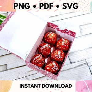 May include: A pink and white patterned box with a white interior, filled with six red chocolate candies. The box is open and the candies are visible. The text "PNG &bull; PDF &bull; SVG" is at the top of the image. The text "INSTANT DOWNLOAD" is at the bottom of the image.
