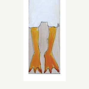 May include: A close-up of a painted wooden bird with yellow legs and red toes. The bird is painted on a light wood background.