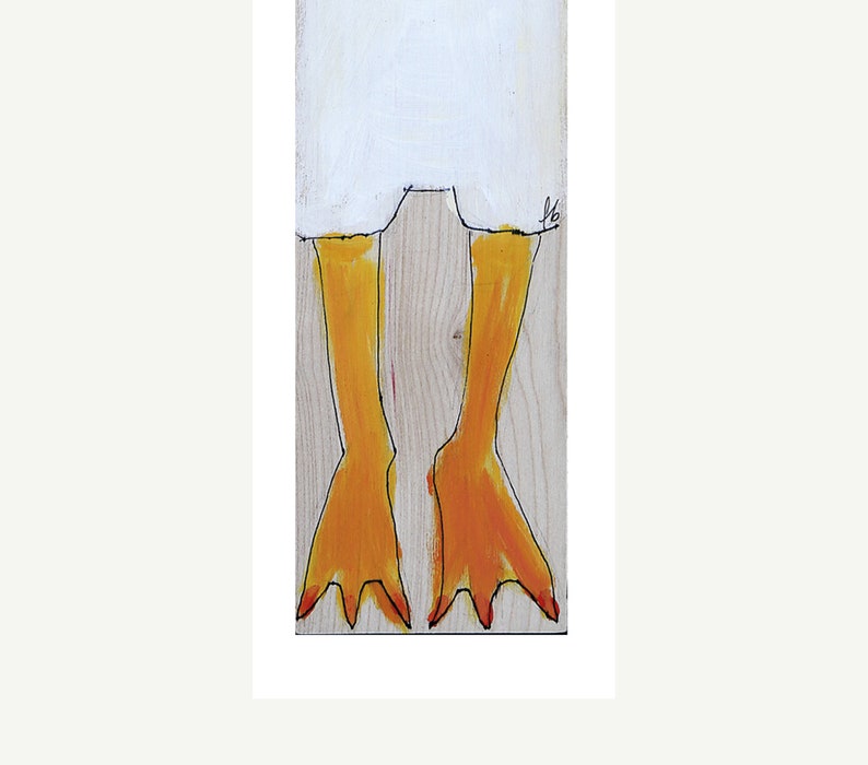 May include: A close-up of a painted wooden bird with yellow legs and red toes. The bird is painted on a light wood background.