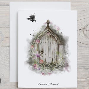 May include: A watercolor greeting card featuring a weathered wooden door adorned with flowers and foliage. A black bird flies above the door. The card is signed "Lauren Stewart".
