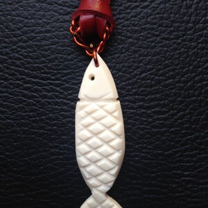Handmade fish from cow bones with leather chain
