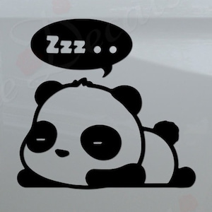 May include: Black and white panda bear decal with a speech bubble that says "Zzz..." on a white truck tailgate.
