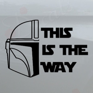 May include: A white pickup truck with a black decal on the side that says "This is the way" with a Mandalorian helmet graphic.