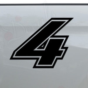 May include: Black vinyl decal of the number "4" with a white outline. The decal is applied to the back of a white pickup truck.