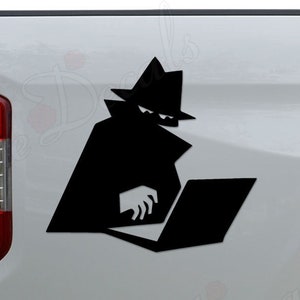 May include: Black and white silhouette of a person wearing a hat and coat, using a laptop. The silhouette is on the side of a white pickup truck.