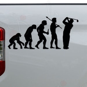 May include: A black vinyl decal of the evolution of man, ending with a golfer holding a golf club. The decal is applied to the back of a white pickup truck.