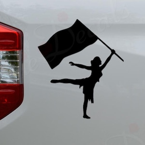 May include: Black vinyl decal of a color guard performer holding a flag, in a dynamic pose. The decal is applied to a white vehicle. The text "Rosie Decals" is at the bottom.