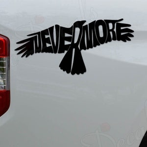 May include: A black vinyl decal of a raven with the word "EVERMORE" forming the bird's wings, applied to the back of a white pickup truck.