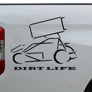 May include: A white pickup truck with a black silhouette of a sprint car and the text "DIRT LIFE" on the side.