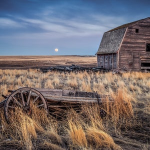 Old Weathered Barn Abandoned In A Rural Countryside Field With A Wagon And The Moon, Rural Art - Fine Art Photography Prints, Canvas, Metal
