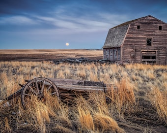 Old Weathered Barn Abandoned In A Rural Countryside Field With A Wagon And The Moon, Rural Art - Fine Art Photography Prints, Canvas, Metal