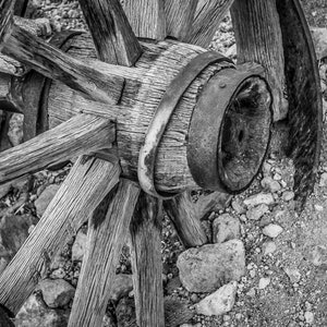 The Remains And Rusty Wheel Of A Wooden Pioneer Wagon Abandoned In A Rural Countryside Field - Fine Art Photography Prints, Canvas, Metal