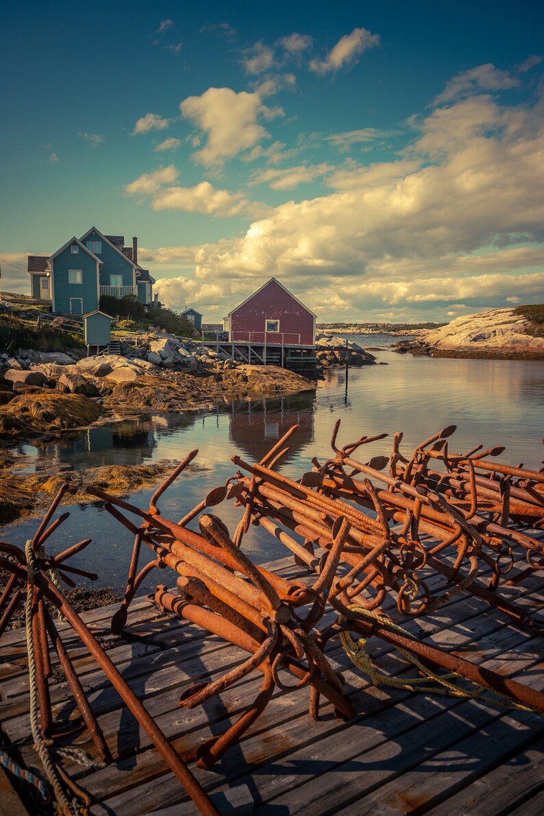 Scenic View Of Buildings In Peggy's Cove Nova Scotia With Small Rusty Trap Anchors On The Dock Fine Art Photography Prints, Canvas, Metal image 1
