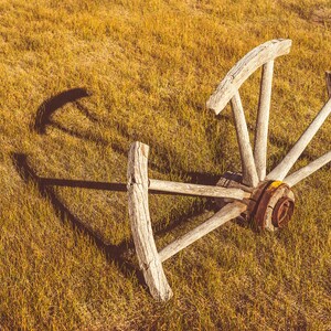 Broken Half Buried Wooden Wagon Wheel Abandoned In The Historic Ghost Town Of Bodie California - Fine Art Photography Prints, Canvas, Metal