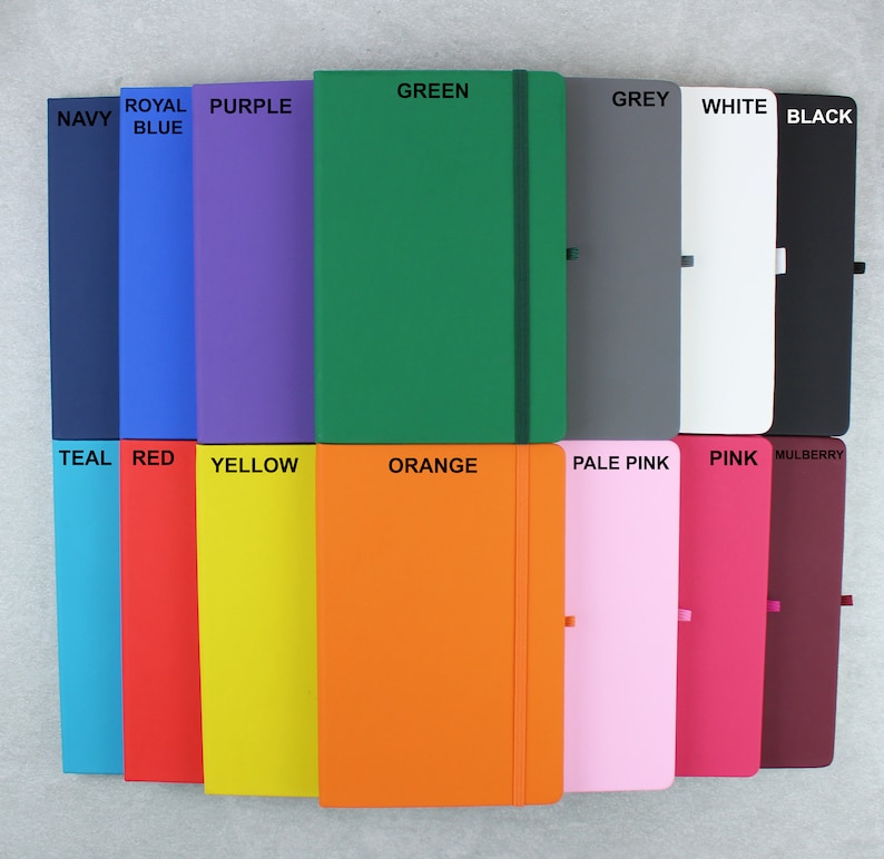 May include: A set of 14 notebooks in various colors, including navy, royal blue, purple, green, grey, white, black, teal, red, yellow, orange, pale pink, pink, and mulberry.