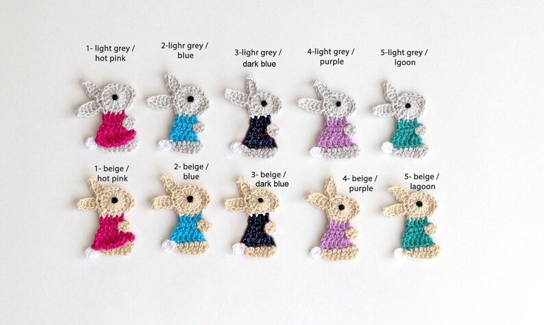 May include: Crocheted bunny appliques in various colors, including light grey, beige, hot pink, blue, dark blue, purple, and lagoon. Each bunny has a different colored dress. Text on the image indicates color combinations.