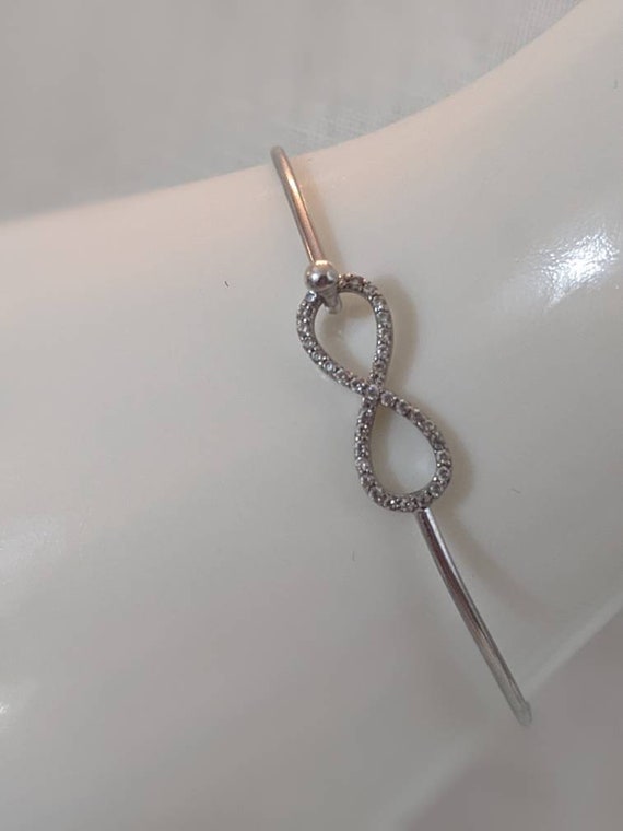 Delicate sterling silver and moissanite infinity b