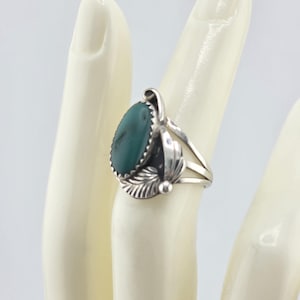Very old green turquoise Navajo ring in sterling silver,  size 7.5, marked &quot;sterling&quot;.