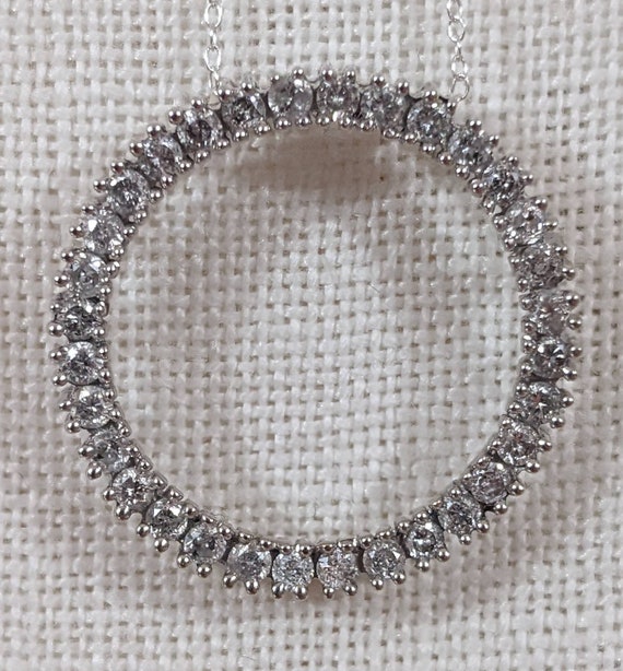 14kt gold and .75ct white diamond circle pendant