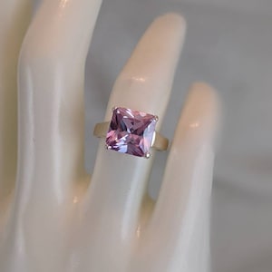Large sparkling princess cut purple CZ and sterling silver ring, size 6 and 3/4