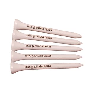 May include: Five white wooden golf tees. Each tee has the text "Iain & Olivia 2023" printed in black. The tees are arranged in a diagonal stack, with the tips pointing to the right.