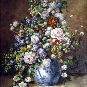 May include: A blue and white porcelain vase filled with a variety of flowers, including white roses, purple lilacs, and yellow wildflowers. The vase is sitting on a light brown surface.