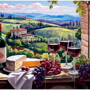 May include: A painting of a Tuscan landscape with a bottle of red wine, cheese, grapes, and wine glasses. The scene includes rolling hills, villas, and a bright blue sky. The wine glasses are filled with red wine.