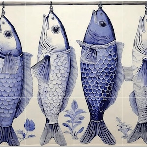 May include: Four blue and white fish illustrations hang from a metal bar. The fish are detailed with scales, fins, and decorative elements. The background is a light cream color with blue floral accents, creating a cohesive design.