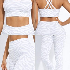 K&ouml;nnte beinhalten: Ein wei&szlig;-graues Sport-BH- und Leggings-Set mit Zebrastreifen. Der Sport-BH hat einen Rundhalsausschnitt und gekreuzte Tr&auml;ger am R&uuml;cken. Die Leggings sind hoch tailliert und haben eine schmale Passform. Die Sportbekleidung ist aus dehnbarem Material.