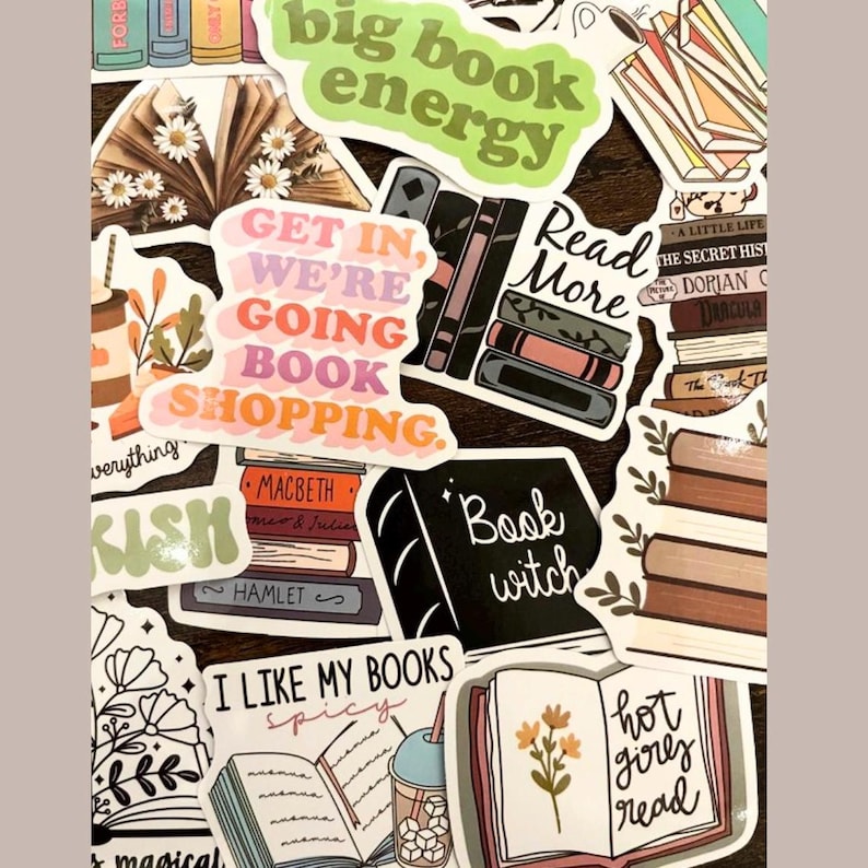 May include: A collection of colorful book-themed stickers with various designs, including stacks of books, flowers, and text like "big book energy", "get in, we're going book shopping", "read more", and "book witch".