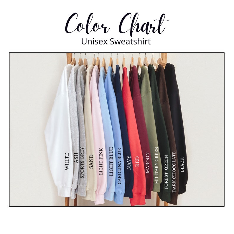 May include: Color chart showing 14 different sweatshirt colors, including white, ash, sports grey, sand, light pink, light blue, Carolina blue, navy, red, maroon, military green, forest green, dark chocolate, and black.