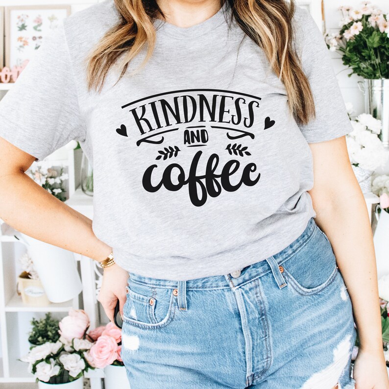 May include: A gray t-shirt with the text "Kindness and coffee" in black lettering with a heart and leaf design.