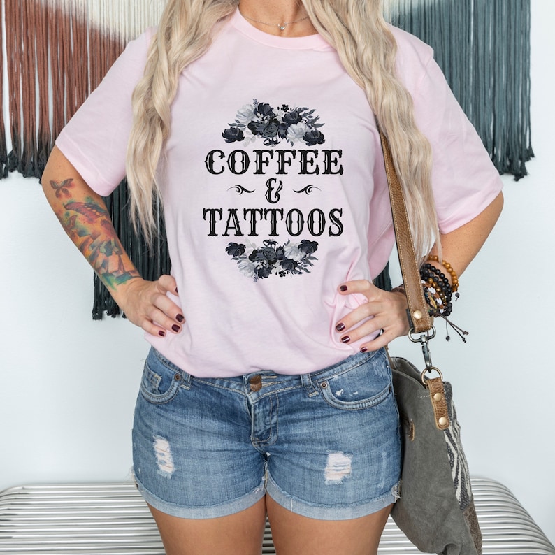 May include: A pink t-shirt with a black floral design and the text "COFFEE & TATTOOS" in a vintage font.