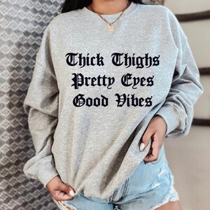 Thick Thighs Make Great Earmuffs Sweatshirt