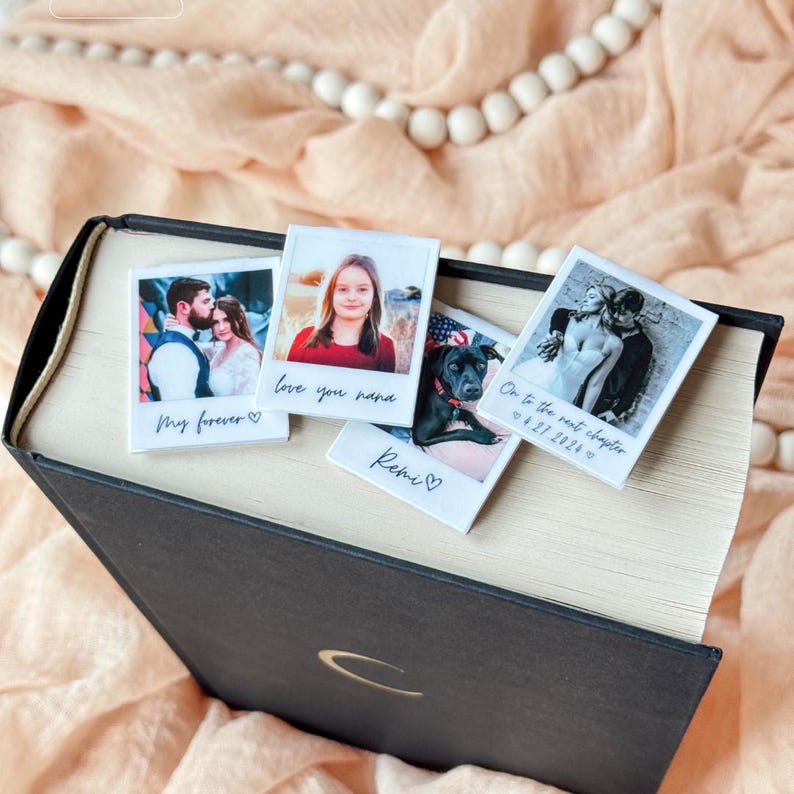 Cluster of personalized polaroid bookmarks: dog photo, romantic wedding shot, and grandchild image.
