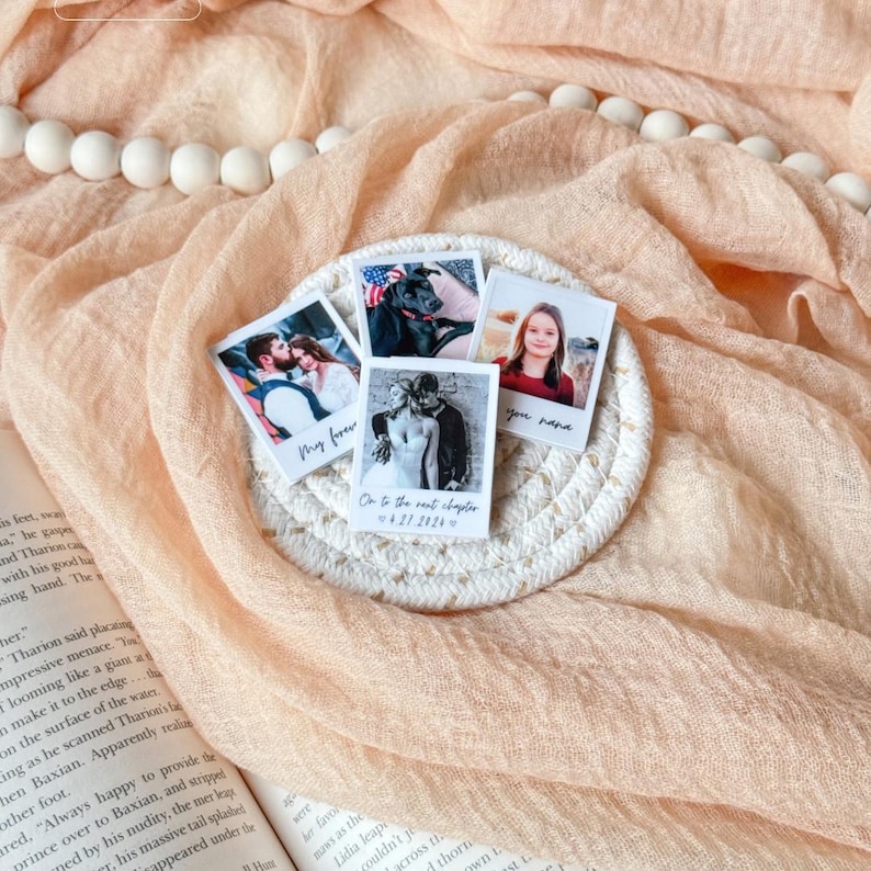 Assorted custom polaroid magnetic bookmarks—pet, wedding, and granddaughter photos—displayed together.