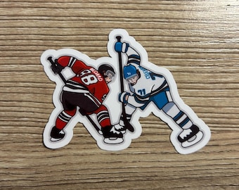 Connor Bedard and Macklin Celebrini Face Off Sticker | Chicago Blackhawks, San Jose Sharks | Water Resistant