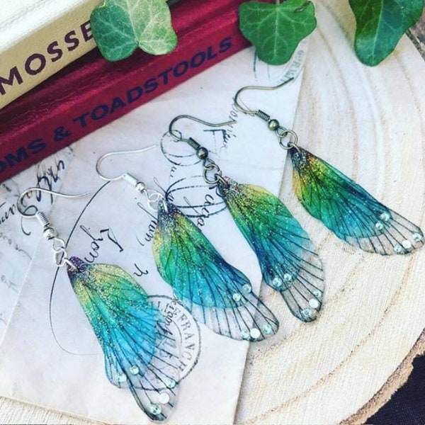 A sweet pair of rainbow faerie wing earrings