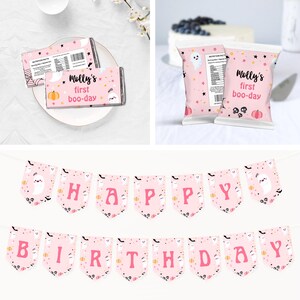 May include: Pink and black Halloween birthday party decorations with a ghost and pumpkin theme. The decorations include a banner that says "Happy Birthday", a chocolate bar wrapper that says "Molly's first boo-day", and a snack bag that says "Molly's first boo-day".