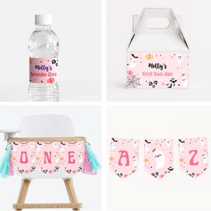 May include: Pink and black Halloween party decorations with a ghost, pumpkin, and bat theme. The decorations include a water bottle label, a favor box, a high chair banner, and a banner with the letters "ONE".