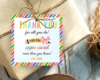 May include: A colorful thank you gift tag with a rainbow striped border. The tag features a pencil with a pink bow and the text "THANK YOU for all you do! YOU ARE appreciated more than you know! LOVE, EMMA".